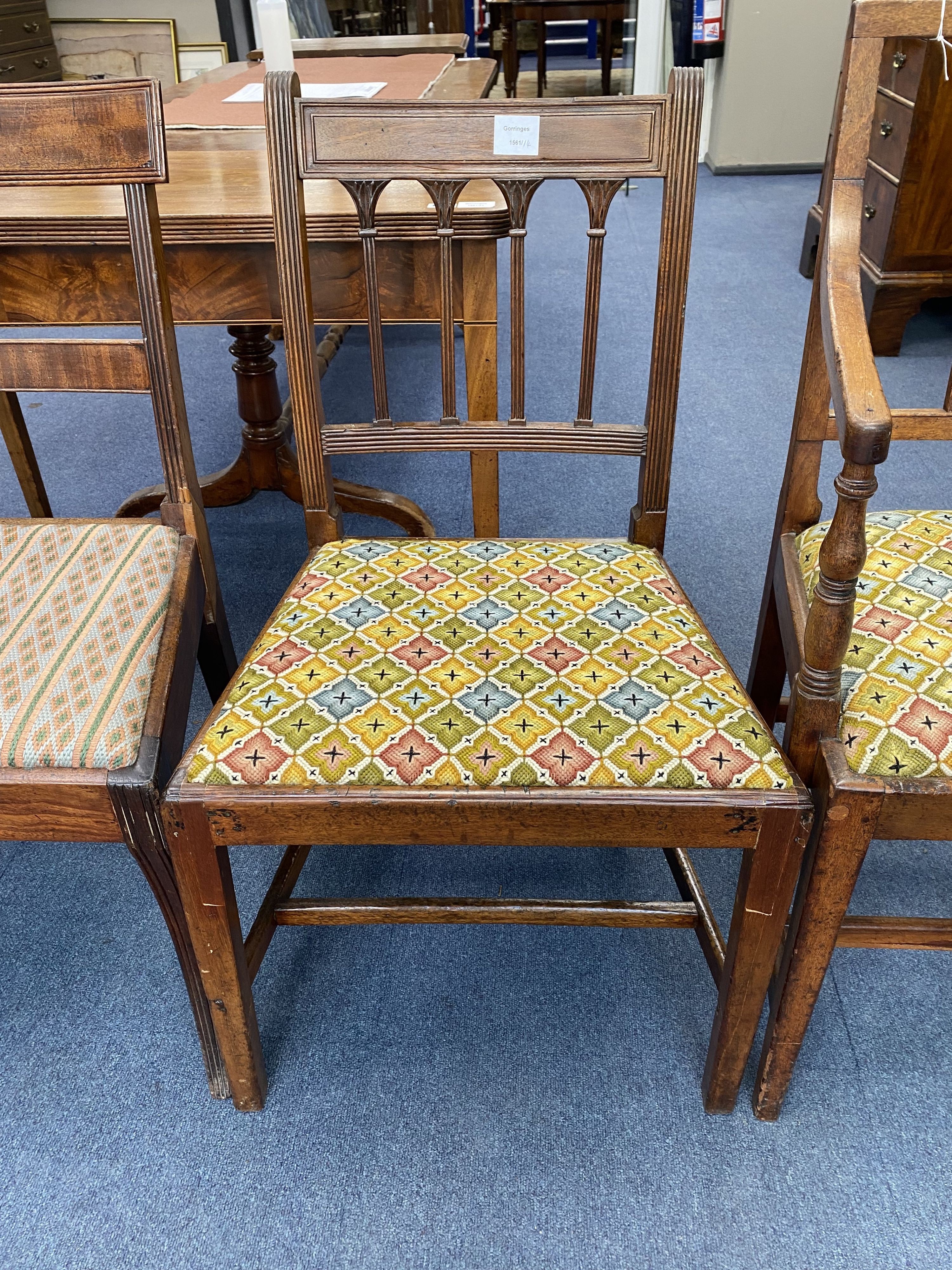 A Regency mahogany elbow chair and three others